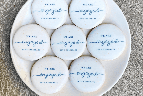 A plate of cookies that say " we are engaged ".